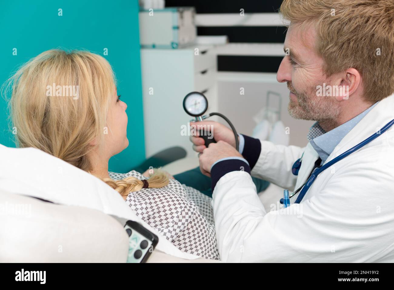 doctor showing pressure female patient Stock Photo Alamy