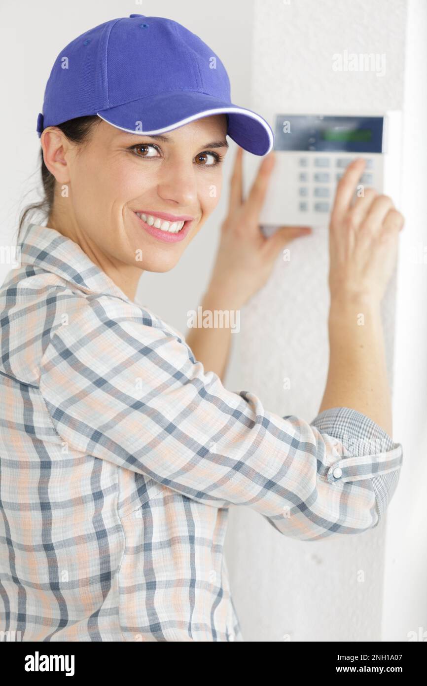 female contractor programming electronic keypad Stock Photo Alamy