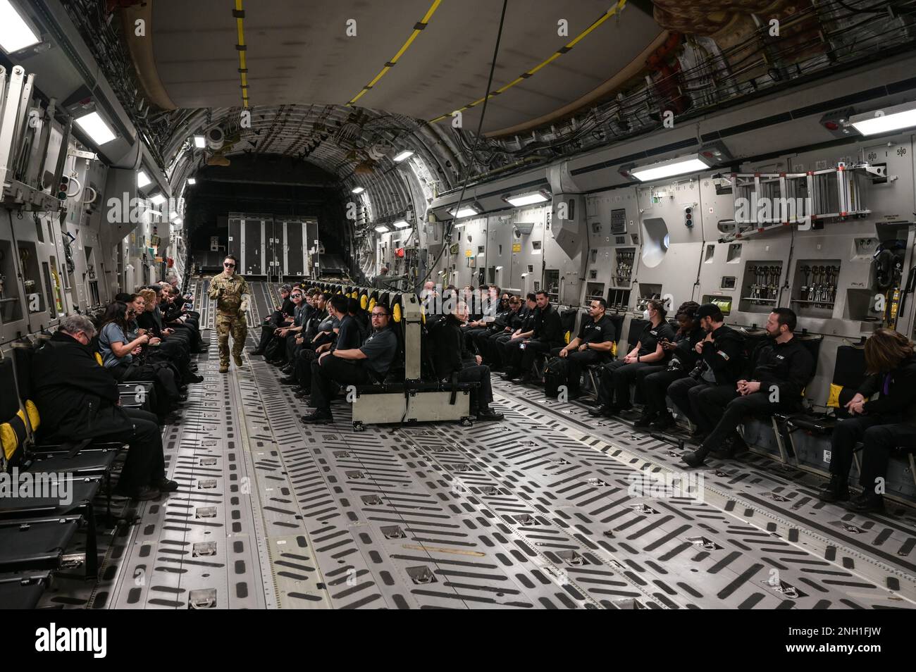 Executive Leadership Development Program participants sit inside of a C-17 Globemaster III fuselage at Joint Base Pearl Harbor-Hickam, Hawaii, Dec. 6, 2022. The 15th Wing was one of several military locations that ELDP participants visited, exposing them to various military operations. Stock Photo