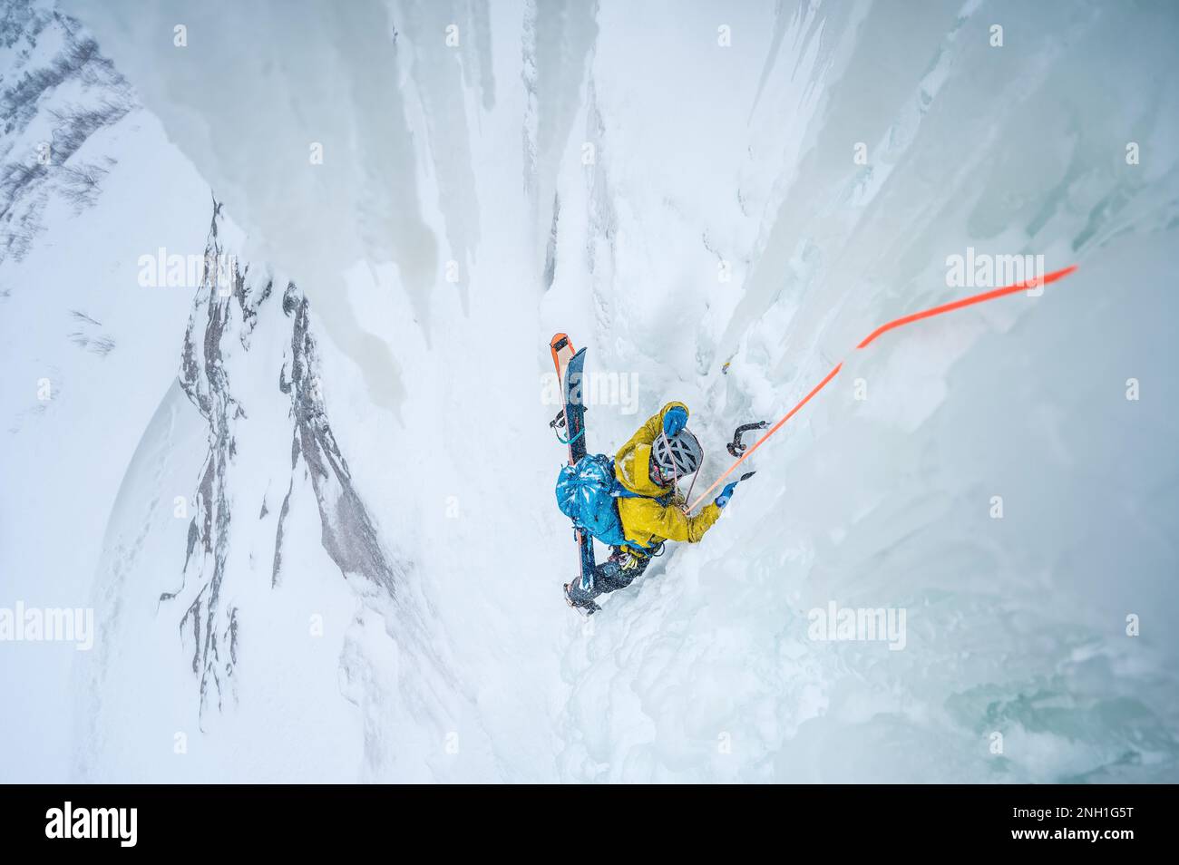 Man climbing steep ice hi-res stock photography and images - Alamy
