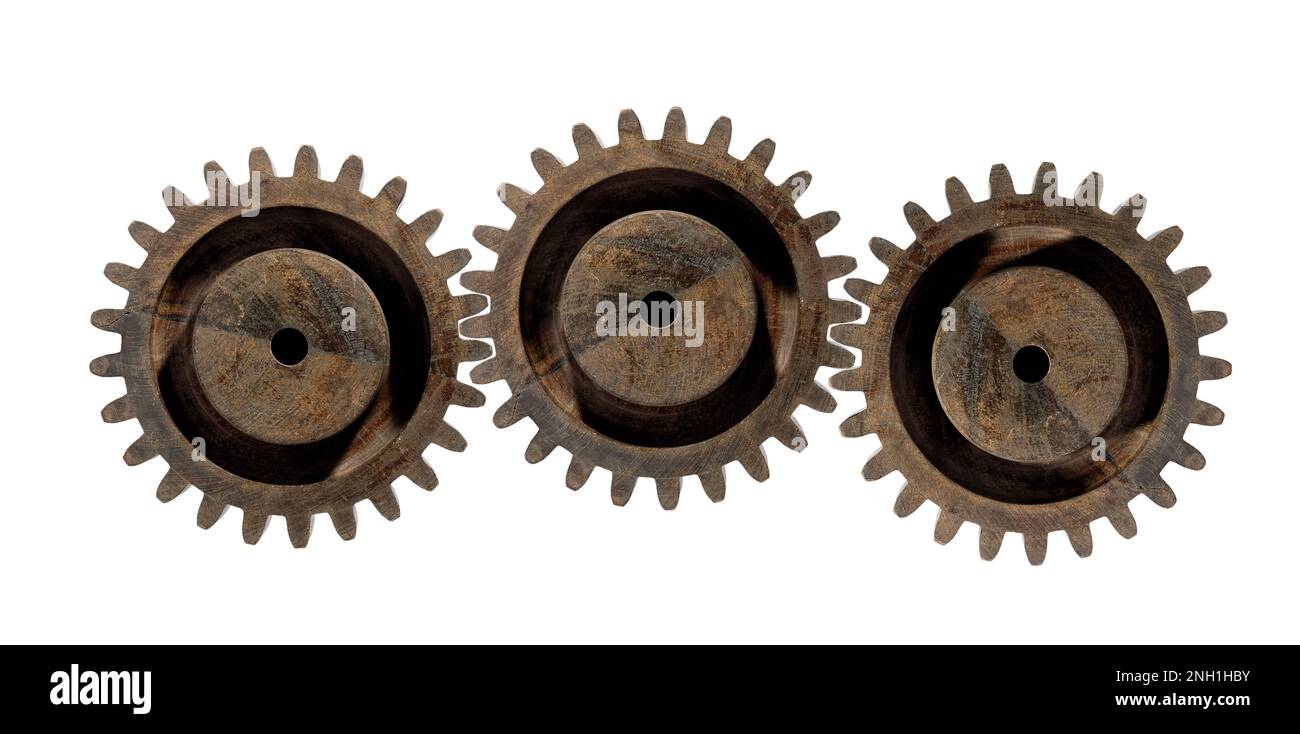 Vintage old wooden round shaped gear wheels of equal size isolated on white background Stock Photo
