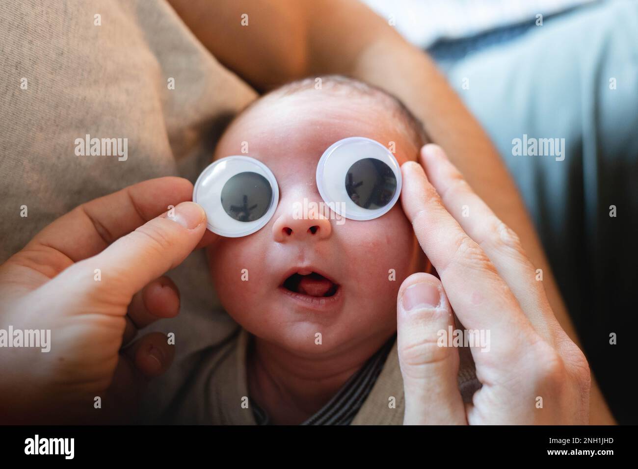 newborn baby with googly eyes Stock Photo Alamy