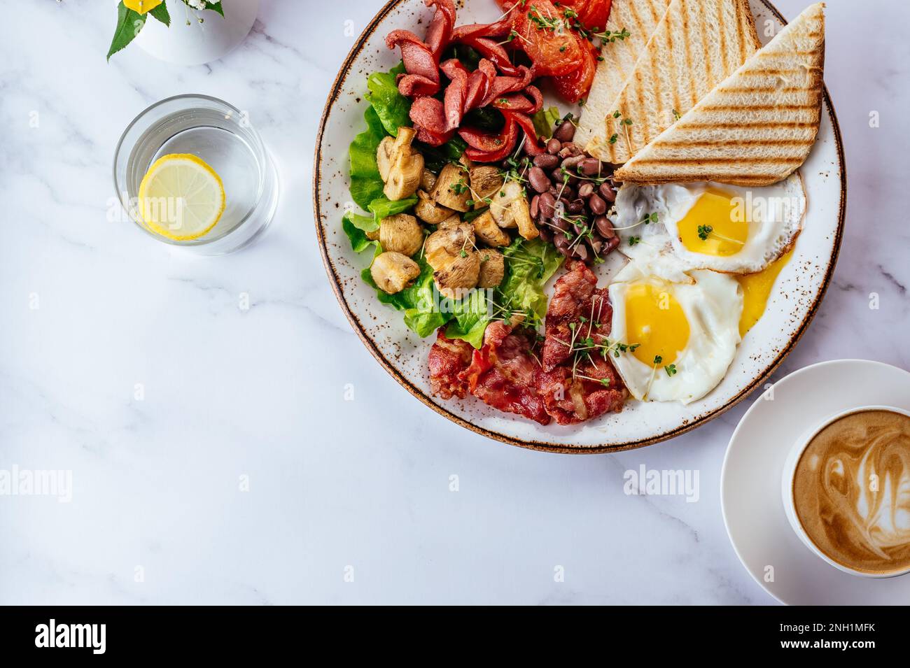 english breakfast with scrambled eggs, bacon, beans, mushrooms a Stock