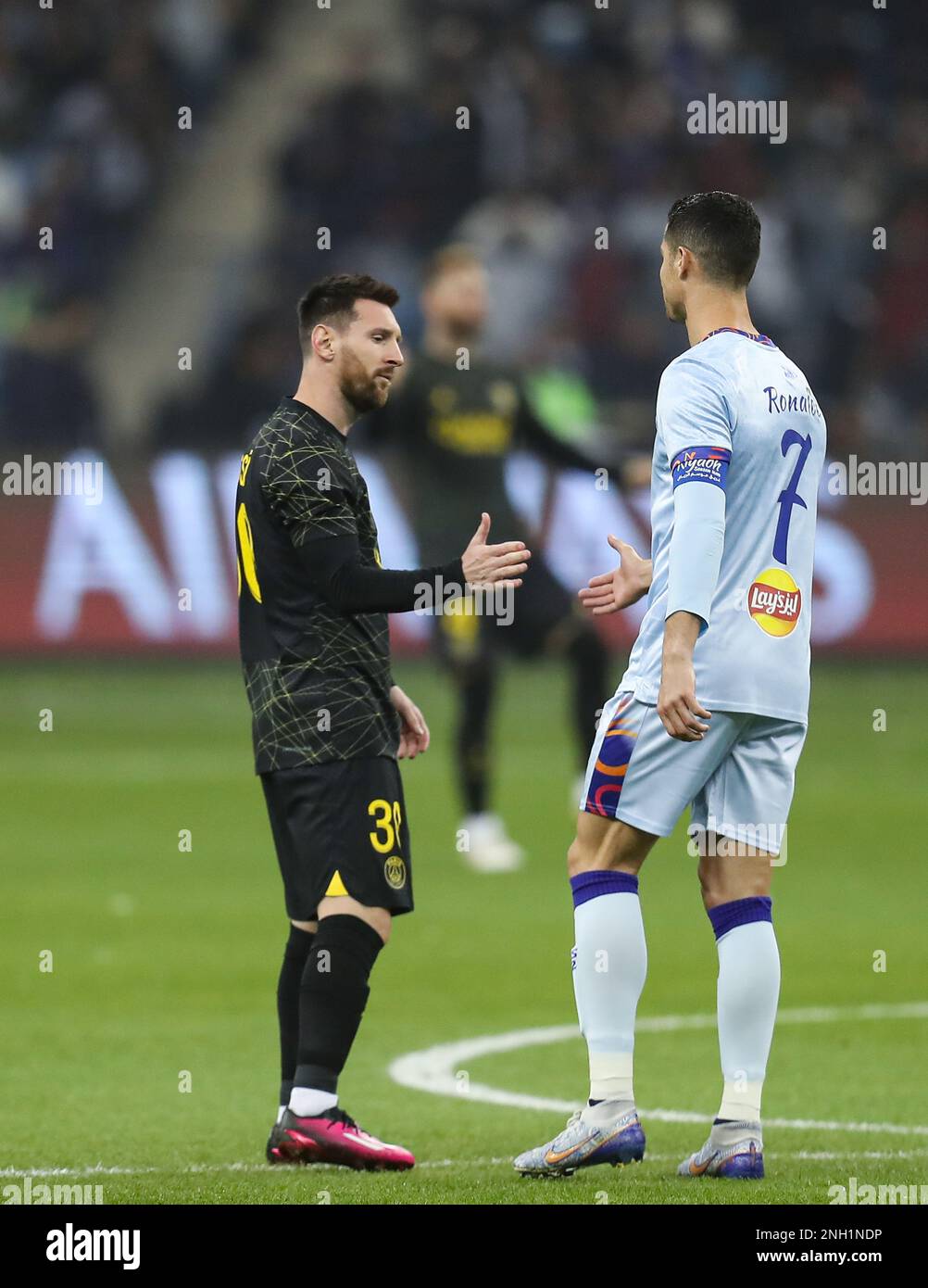 Lionel Messi (L) and Cristiano Ronaldo great each other prior Riyadh All-Star XI vs Paris Saint-Germain FC at King Fahd Stadium on January 19, 2023 in Riyadh, Saudi Arabia. Photo by Stringer/ Power Sport Images Stock Photo