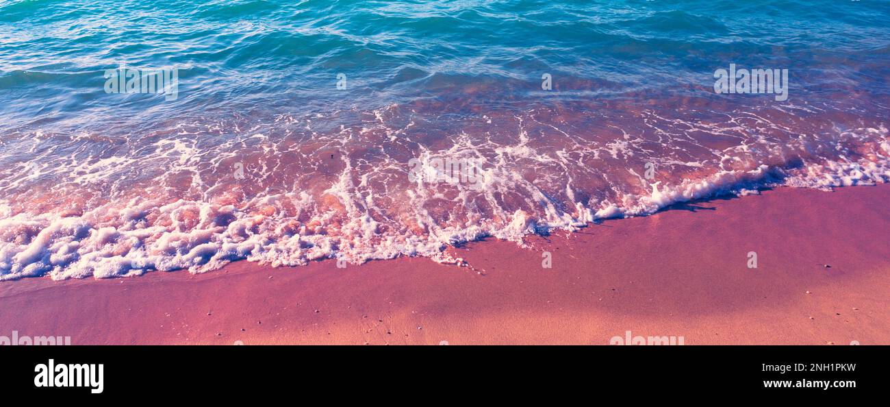 Seascape at sunset. Beautiful beach in the evening. Surf line. Horizontal banner Stock Photo