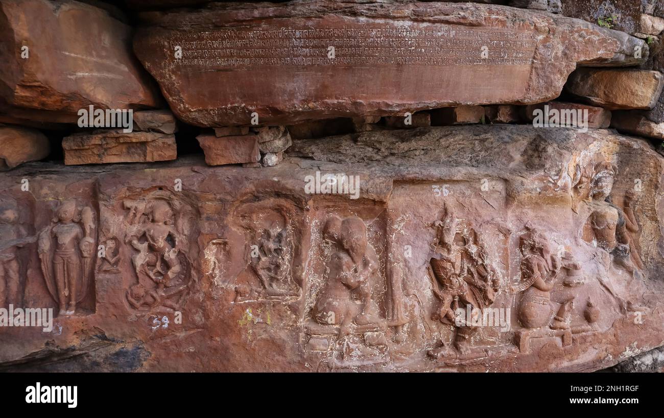 Carvings of Hindu deities and Chandela script on the wall of Ajaygarh Fort, Panna, Madhya Pradesh, India. Stock Photo