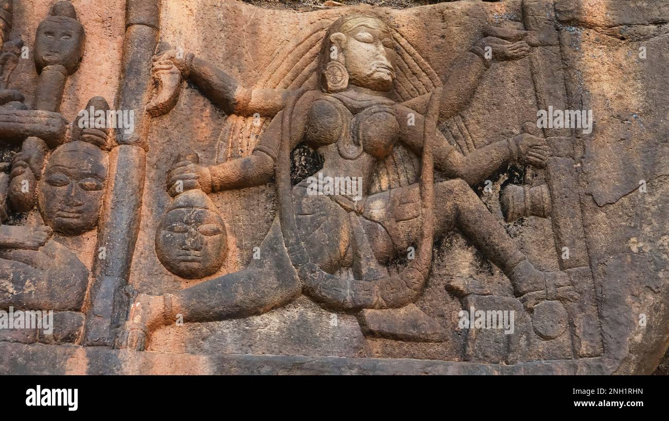 Tantrik Naudurga sculpture closeup . Each Goddess seems to be sitting above two dead bodies.  North entrance of Ajaygarh Fort, Panna, Madhya Pradesh, Stock Photo