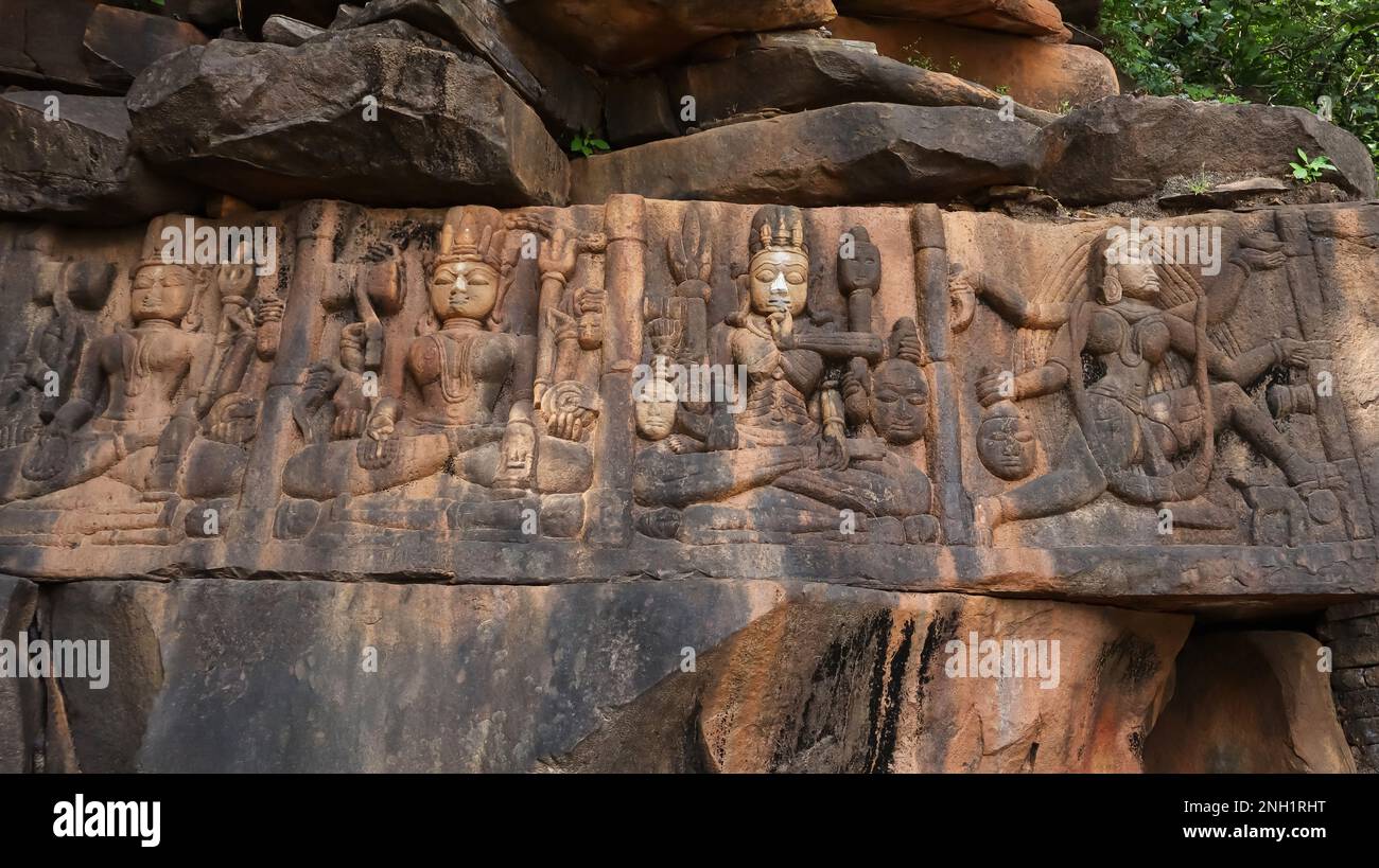 Tantrik Naudurga sculpture, each Goddess seems to be sitting above two dead bodies, wall of Ajaygarh Fort, Panna, Madhya Pradesh, India. Stock Photo