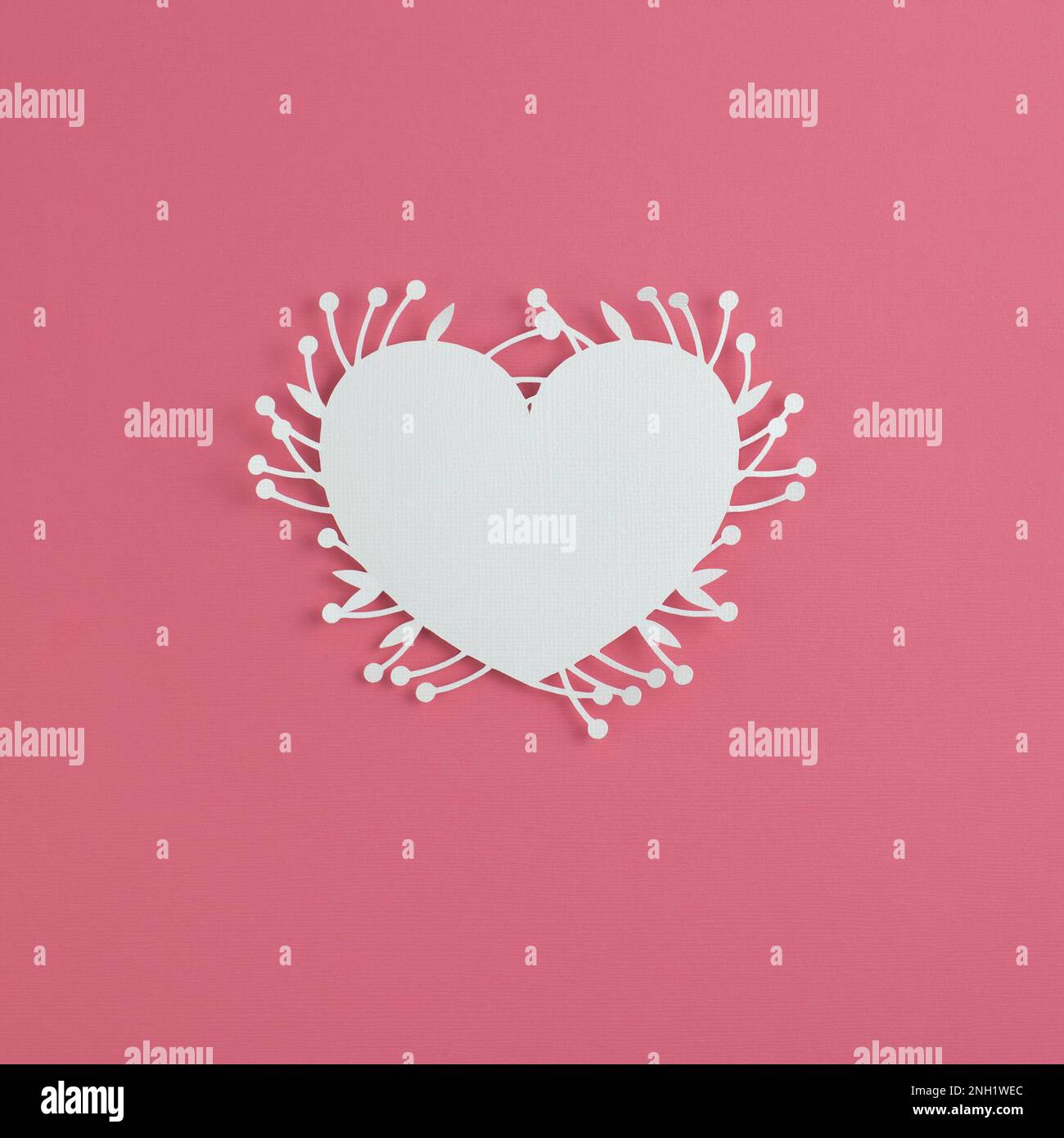 Romantic card background, white heart on a pink background, paper cut ...