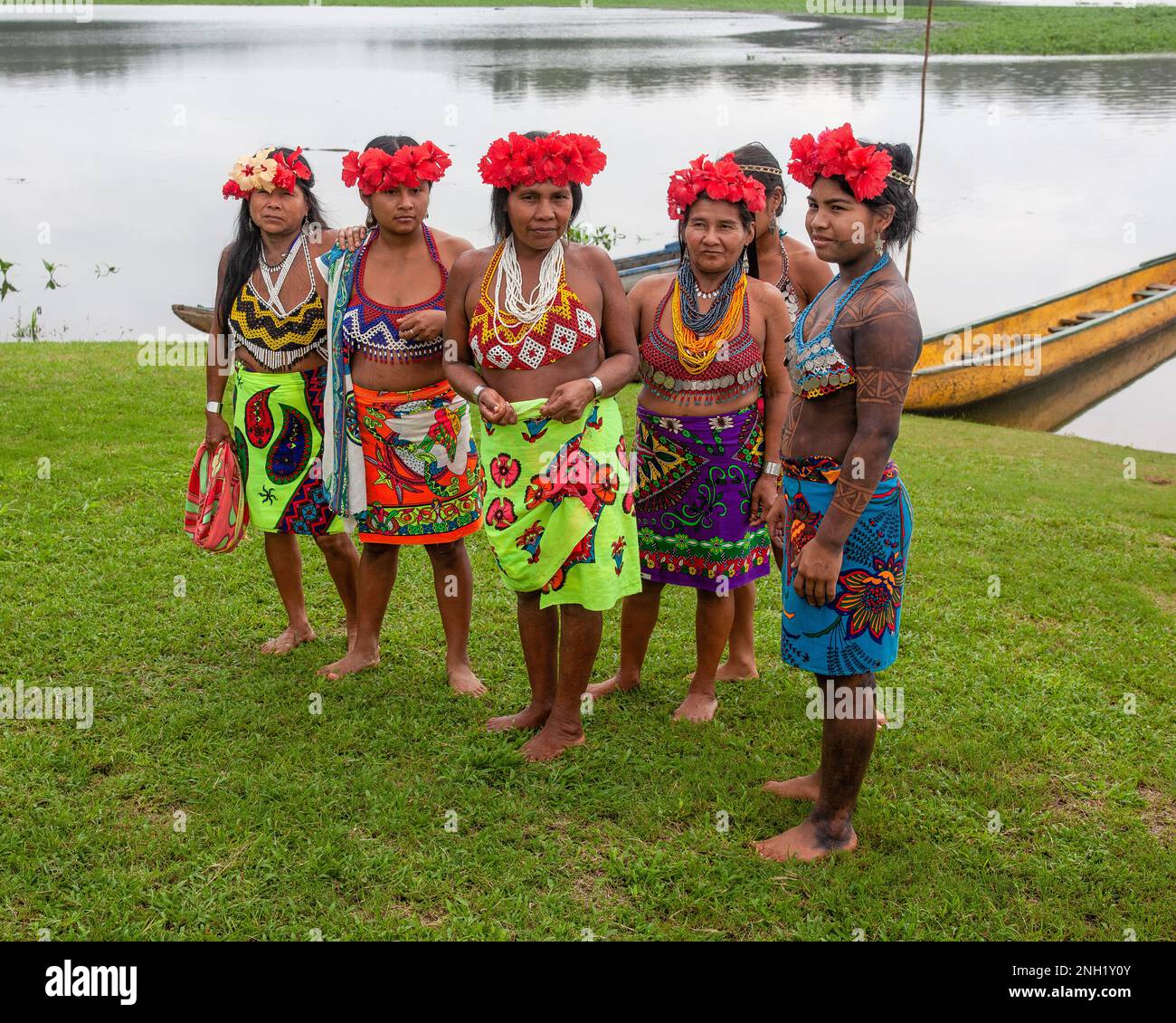 Indigenous Embera women dressed up for visitors in their village on Lake Alejuela in Panama.  Their skin is painted with the juice of the jagua berry Stock Photo