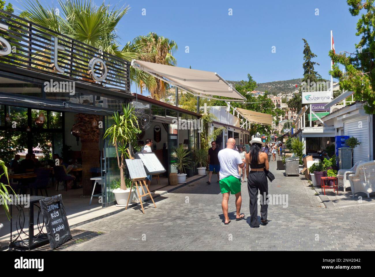 Restaurants and shops on the harbour frontage at Kalkan, Turkey. July 2022 Stock Photo