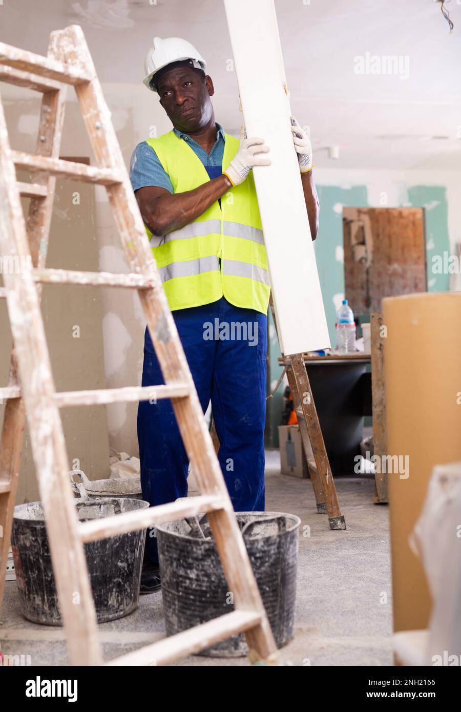 African american worker carries hi-res stock photography and images - Alamy