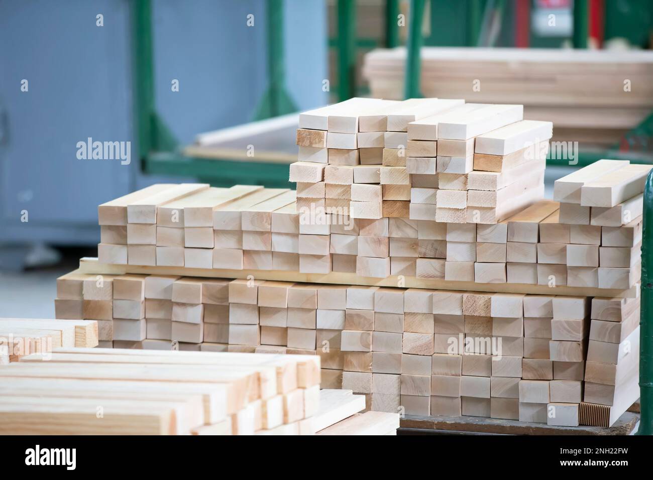 Stock pine wood log in furniture factory. Piles of wooden boards in