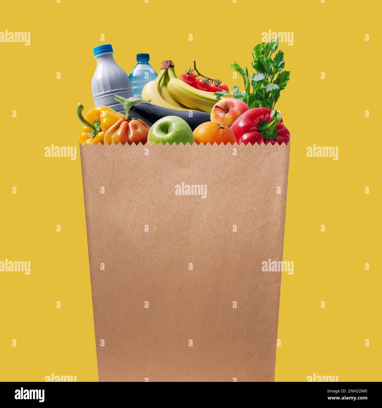 Paper grocery bag full of groceries food and retail concept Stock