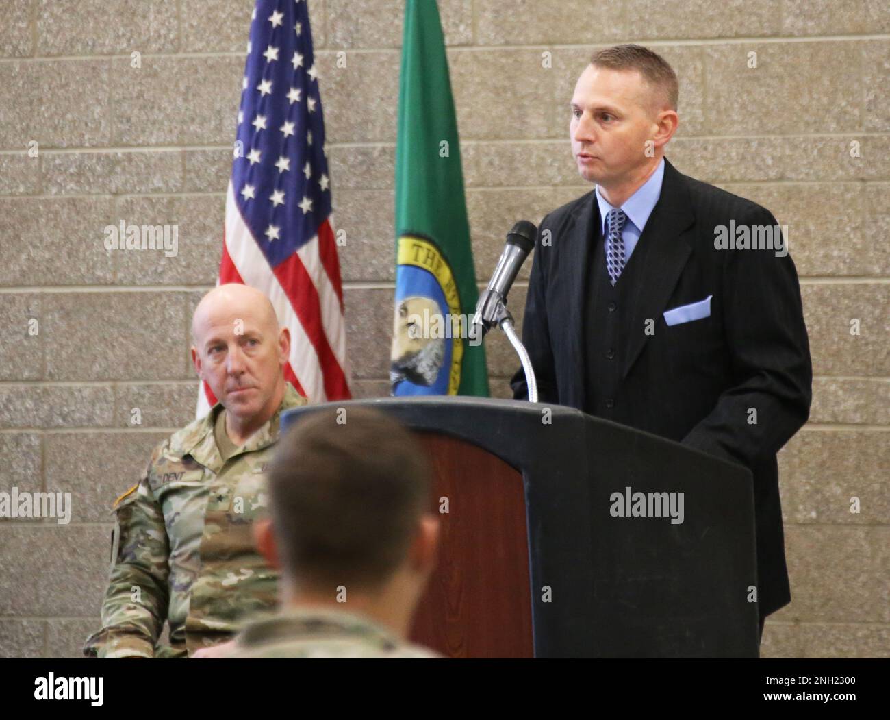 Mr. Adam Iwaszuk, Director of the Construction and Facilities Management Office, Washington National Guard, addresses the audience during the ribbon cutting for the Tri-Cities Readiness Center in Richland, Wash. on Dec. 7, 2022. Stock Photo