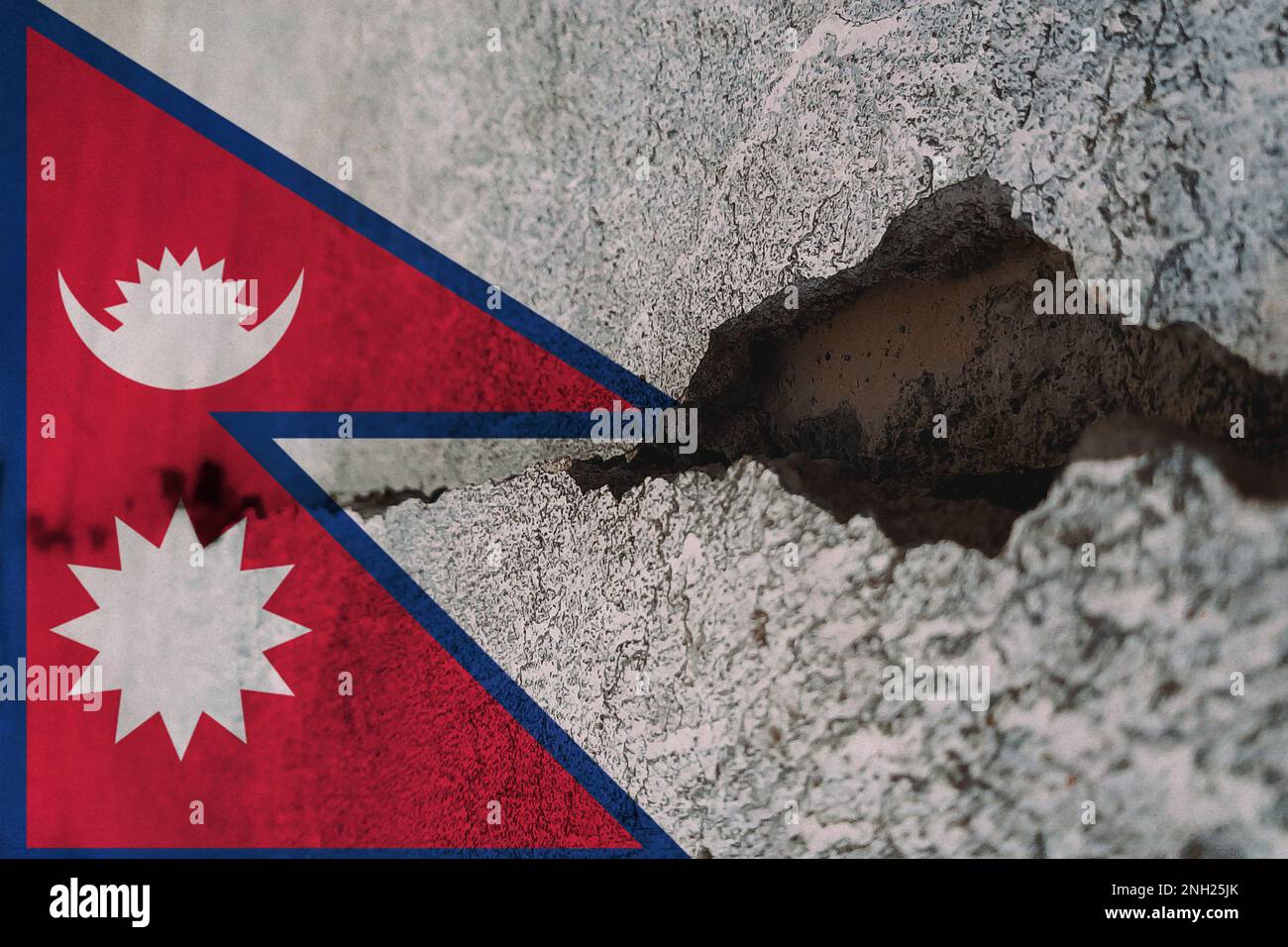 Nepal flag on cracked wall. Earthquake or drought concept Stock Photo