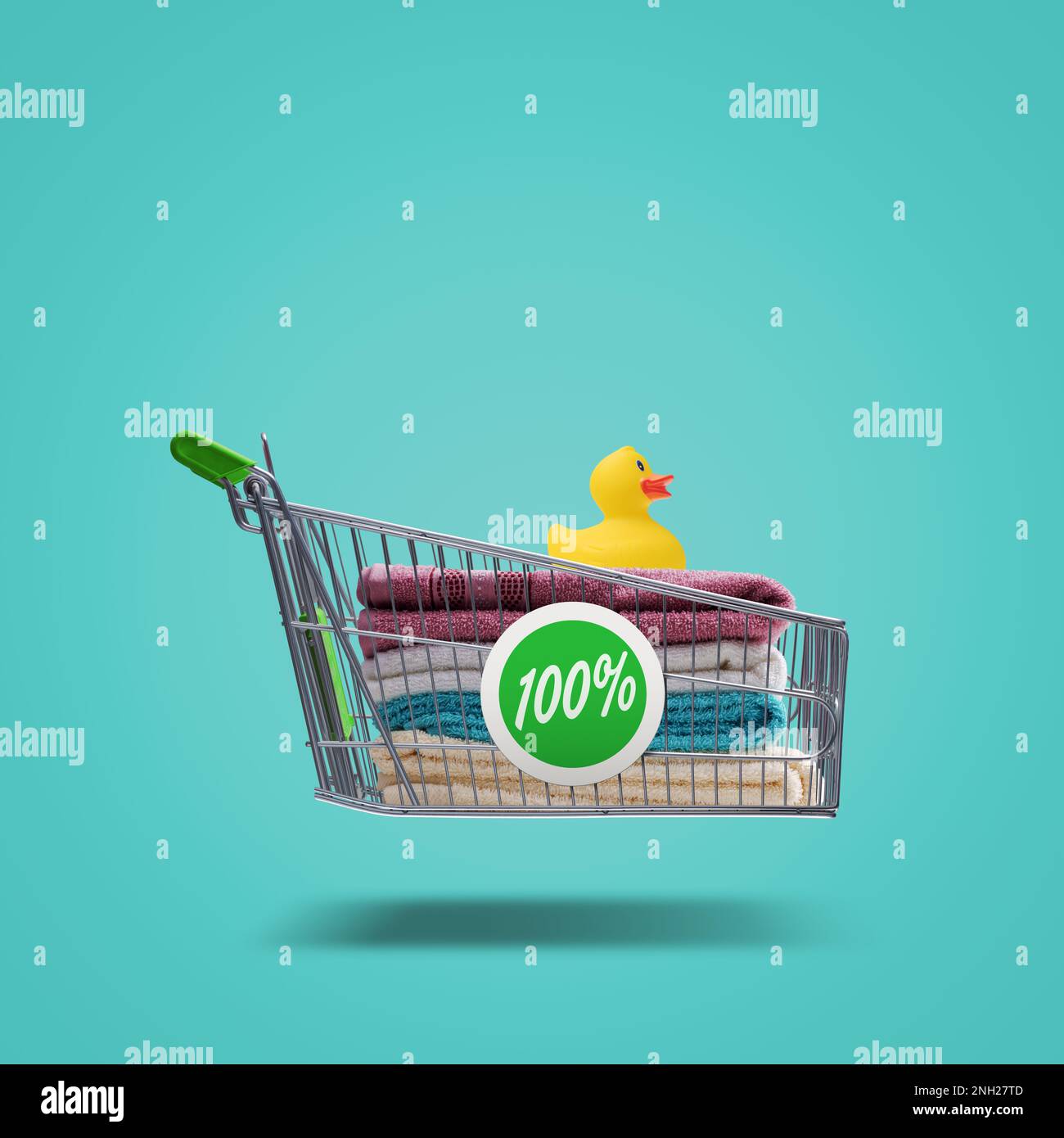 Colorful bath towels and rubber duck in a flying shopping cart, household items and shopping concept Stock Photo