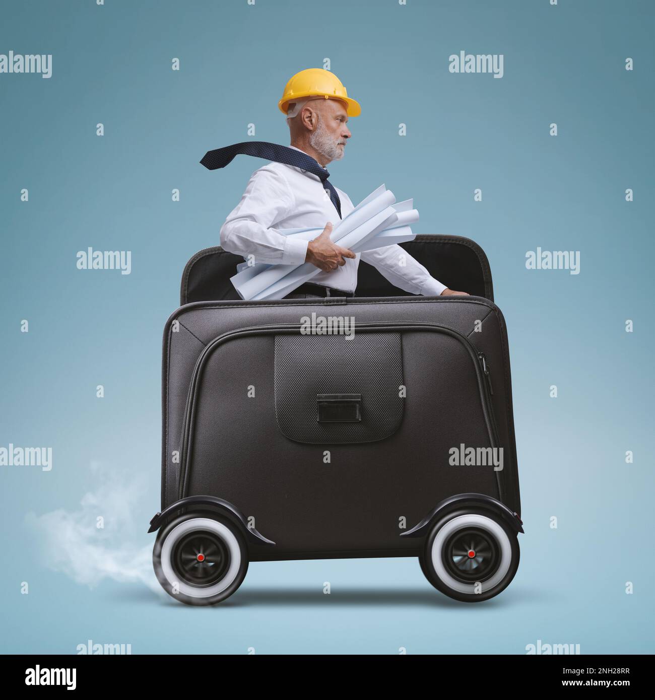 Professional architect riding a briefcase with wheels and reaching a