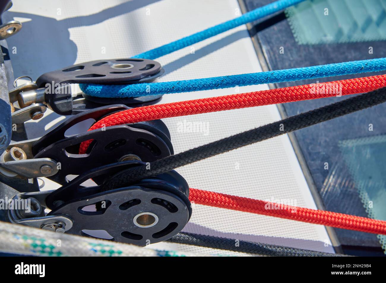 Pulleys with colored lines on a sailing ship Stock Photo