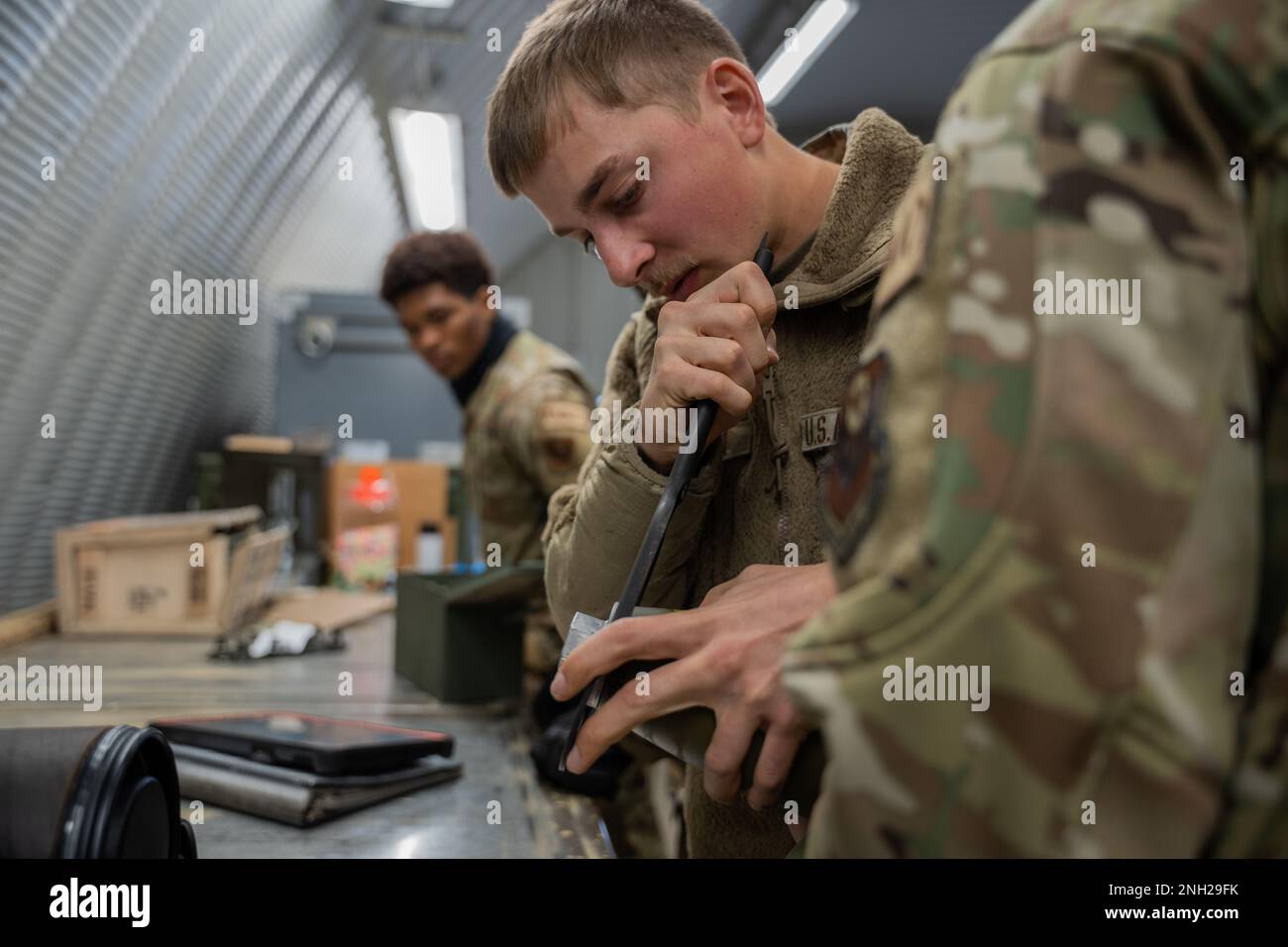 U.S Air Force Airman 1st Class Matthew Bohlman, 27th Special Operations Munitions Squadron conventional maintenance crew chief, unscrews the nose plug on a PGU-45 to attach a FMU-160 fuse in preparation of a training exercise at Cannon Air Force Base, N.M., Dec. 7, 2022. The exercise demonstrates the 27th Special Operations Munitions Squadron ability to practice Agile Combat Employment by arming and rearming troops in austere environments. Stock Photo