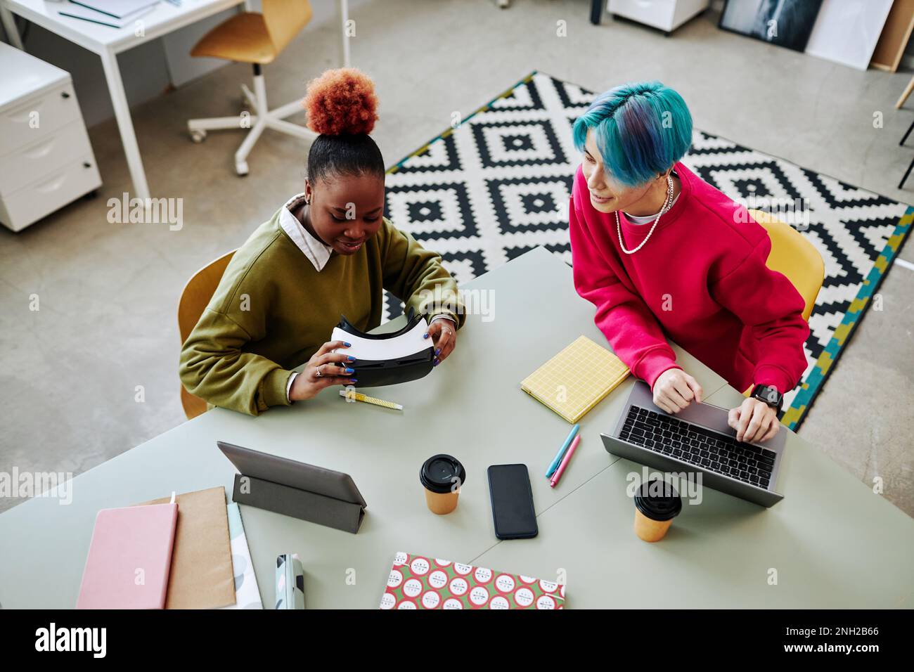 Top view at two creative young people developing VR software in office Stock Photo