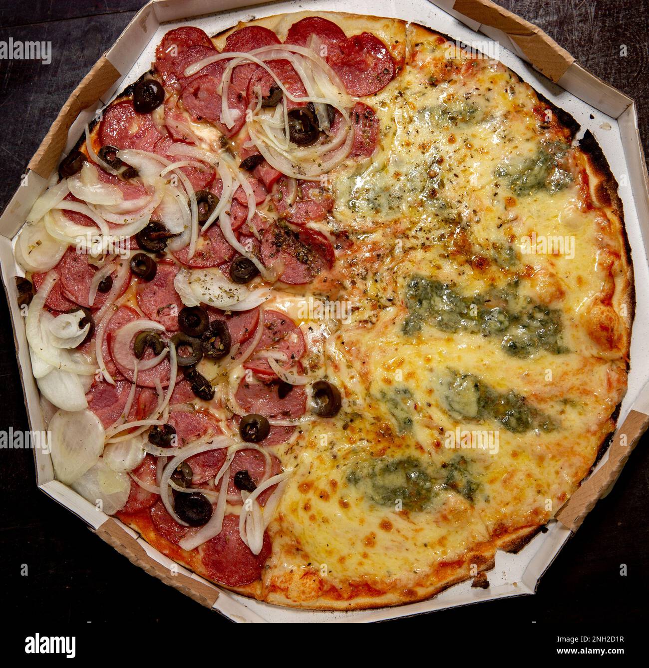 Popular Brazilian pizza half four cheeses and half pepperoni sausage