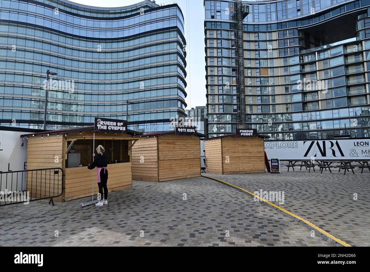 Independent traders by new build apartment and office buildings at Battersea Power Station in South London, UK. February 2023. Stock Photo