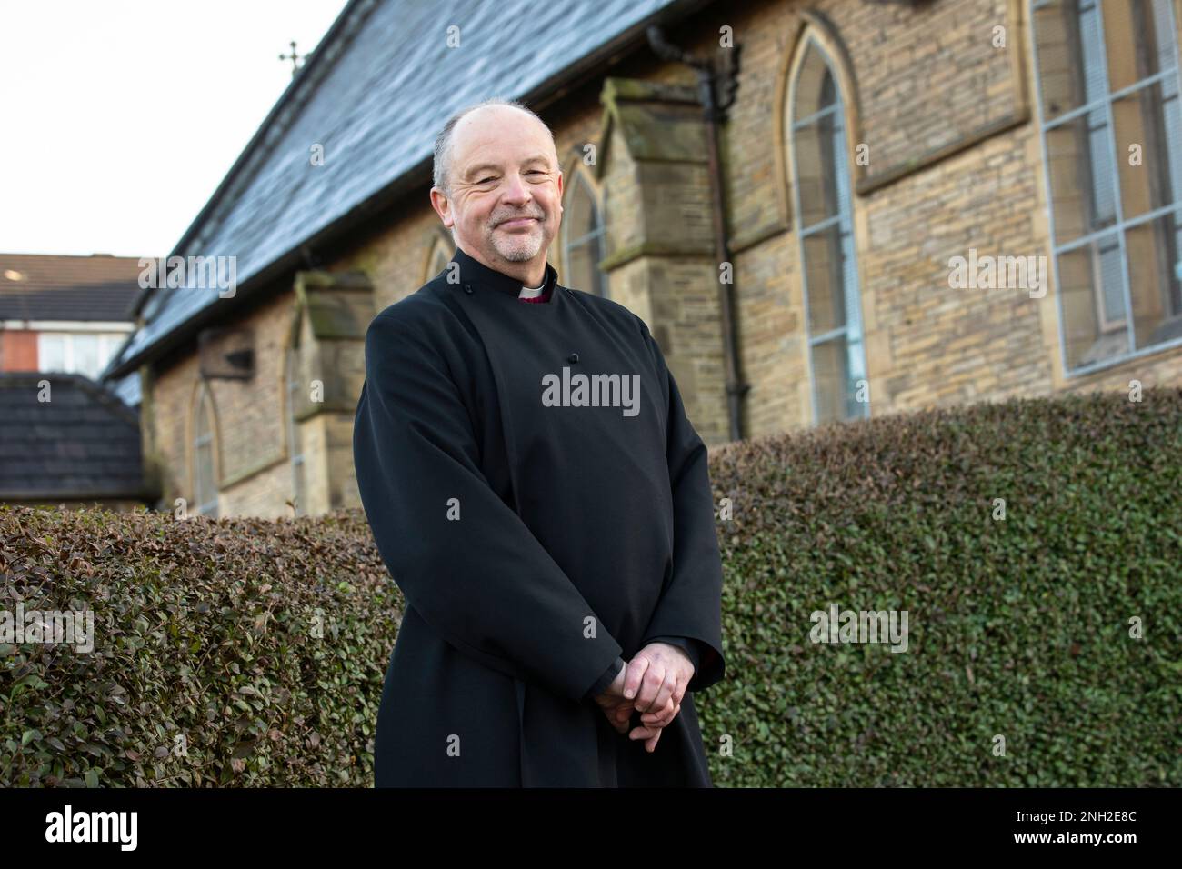 Anglican Vicar in a church. Oldham. Manchester. United Kingdom. Stock Photo