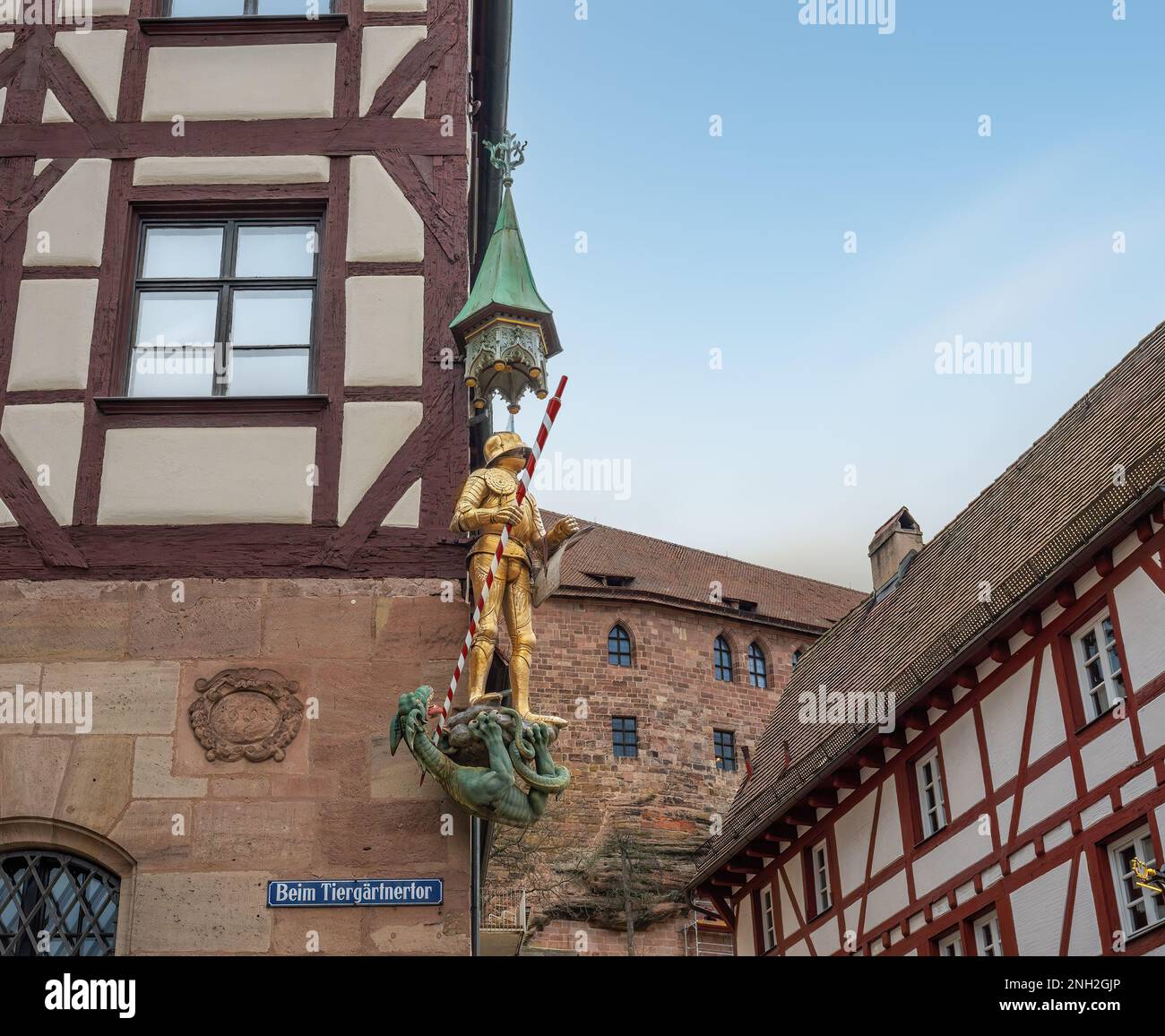 St. George and dragon Statue on a building at Tiergatnertor Square - Nuremberg, Bavaria, Germany Stock Photo