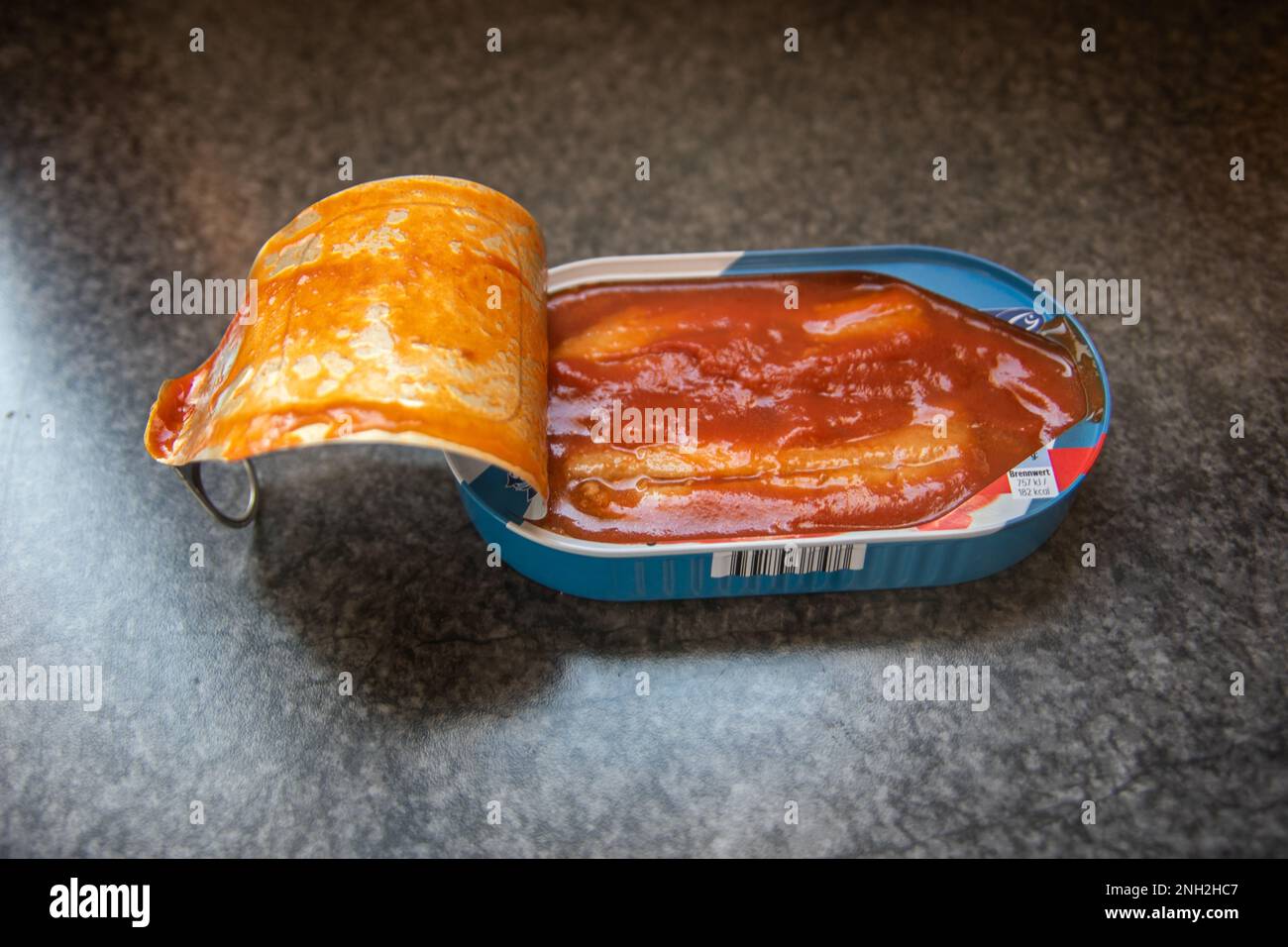 opened can of herring in tomato sauce Stock Photo Alamy