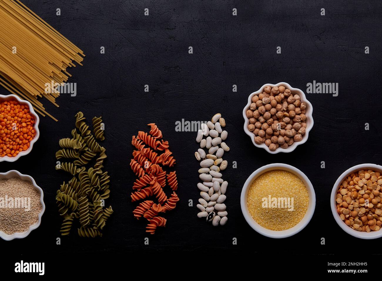 Aesthetic assortment of cereals and gluten free pasta background, low