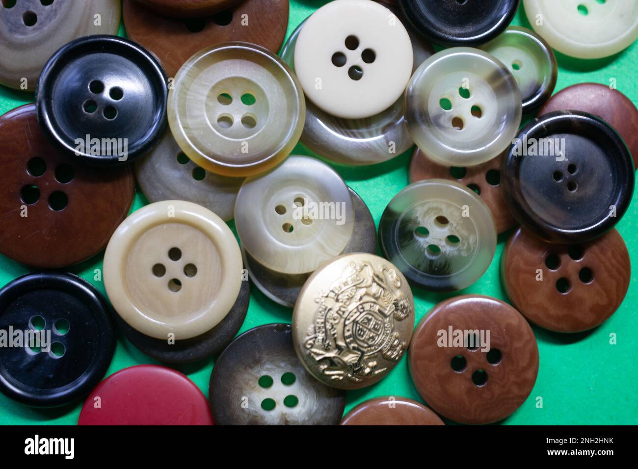 a large number of buttons for clothes in a heap Stock Photo