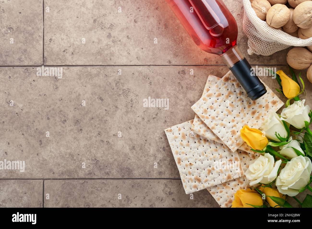 Passover celebration concept. Matzah, kosher red wine, walnut and white