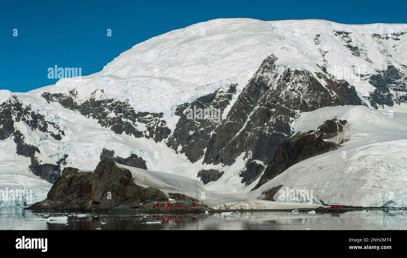 Scientific base with snowy mountains landscape, Antarctic Peninsula. Stock Photo
