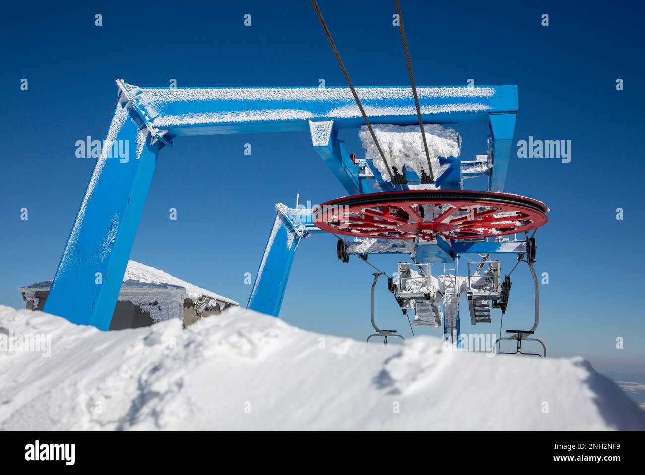 Metal mechanical coil for an old ski lift in the mountains, old lifting
