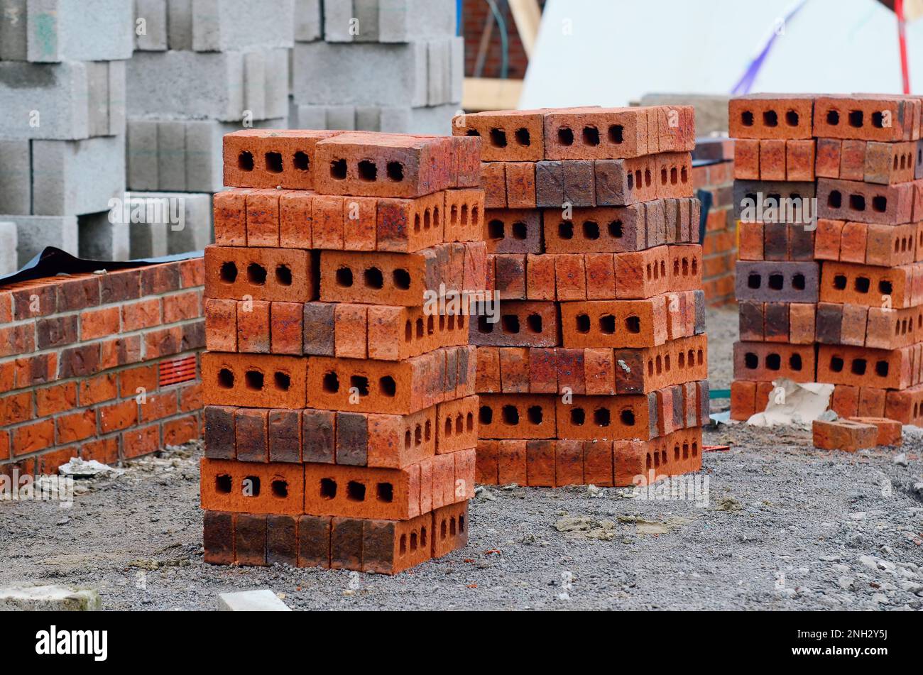 Red bricks and concrete blocks delivered on construction site and