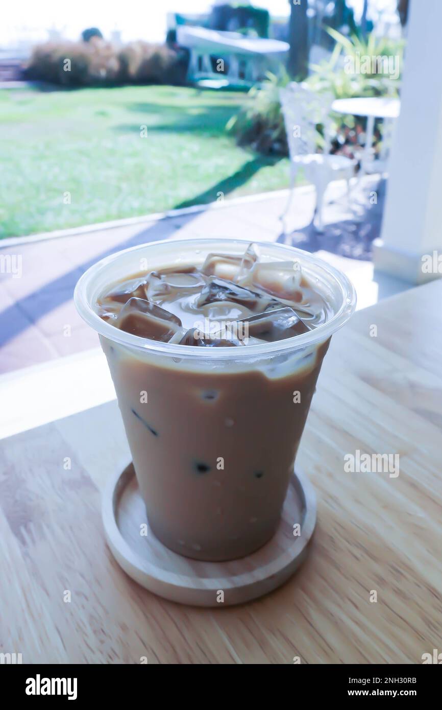 Vanilla iced latte served in a plastic to go cup Stock Photo - Alamy