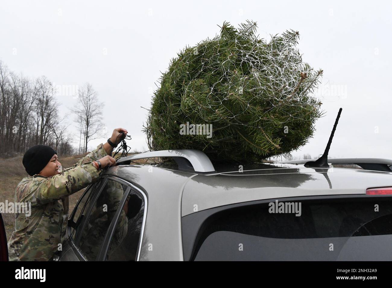 Fort Drum community members receive their free Christmas trees Dec. 9