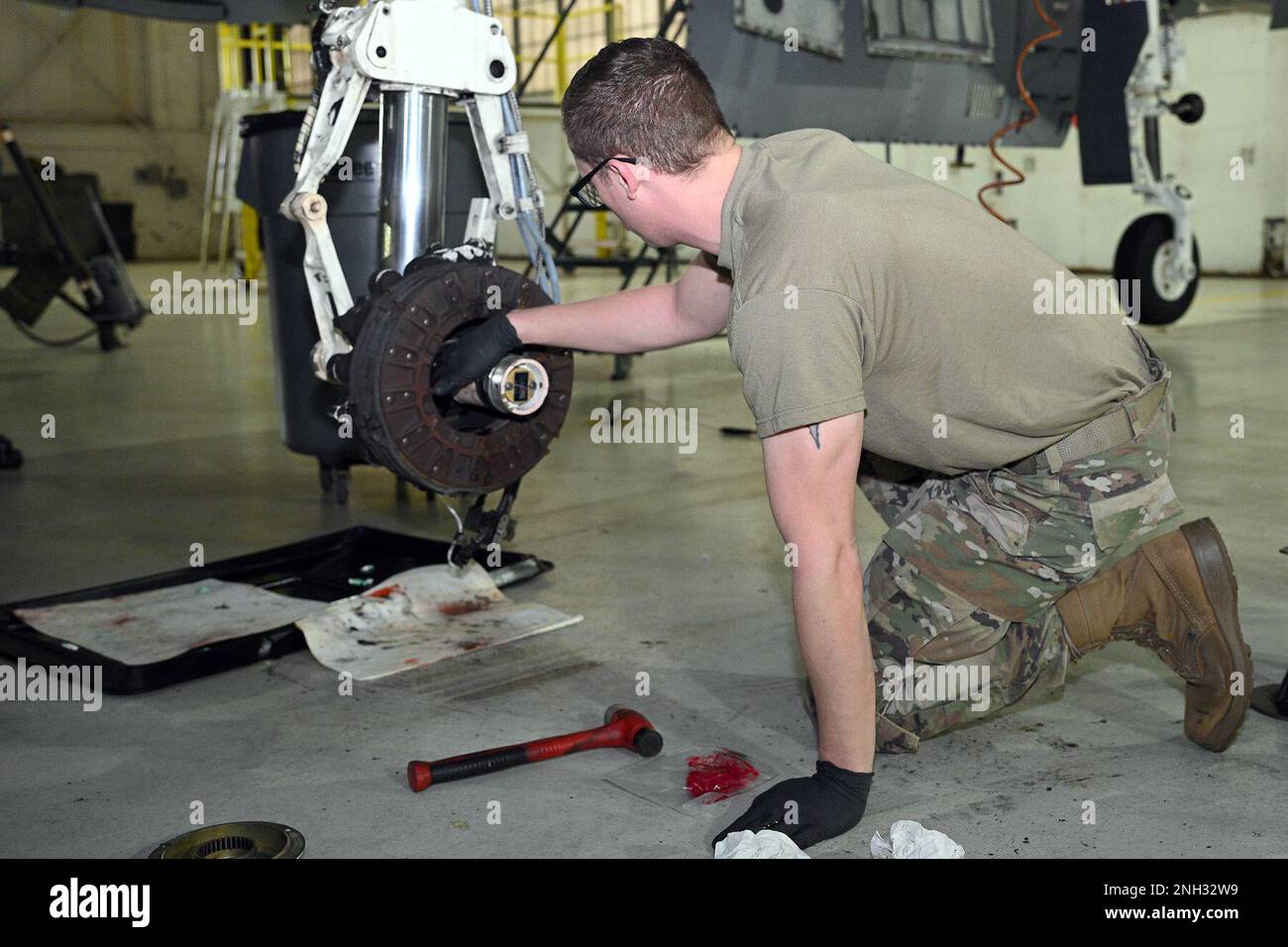 Master Sgt. Keith Hardy, phase work leader, aircraft mechanic, from the 127th Maintenance Squadron, Selfridge Air National Guard Base, Michigan, repack the brake and wheel assembly strut on an A-10 Thunderbolt II during a Phase 1 inspection on Dec. 9, 2022. Airmen of the 127th Maintenance Squadron phase crew are tasked to perform detailed inspections to make sure this complex jet remains air ready. Stock Photo
