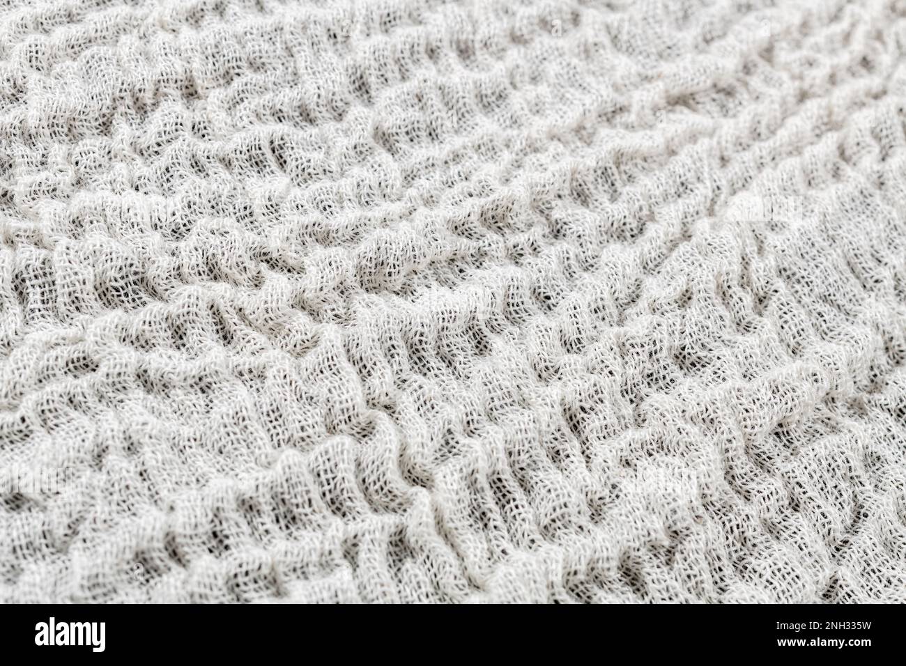 Close shot of cotton cheesecloth material fabric washed & dried but