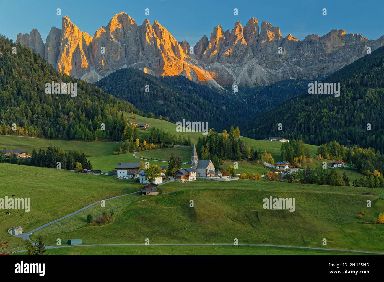 Landscape of Santa Maddalena Alta, Val di Funes, at sunset, on the italian Dolomites, with fall colors Stock Photo
