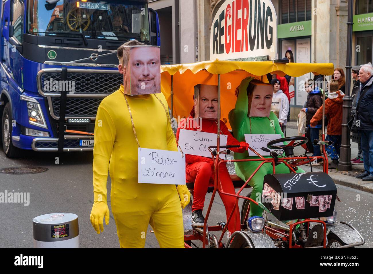 Leipzig, Germany. 19th Feb, 2023. People dressed in carnival costumes and masks of the German Federal Chancellor Olaf Scholz, Minister of Finance Christian Lindner and Minister of Foreign Affairs Annalena Baerbock take part during the carnival parade 'Große Leipziger Rosensonntagsumzug' (Great Leipzig Carnival Procession) in the city center. After three years of forced break because of the Coronavirus pandemic, the Leipzig carnival parade took place again on carnival Sunday. Shrovetide carnivals take place this week throughout Germany. Credit: SOPA Images Limited/Alamy Live News Stock Photo