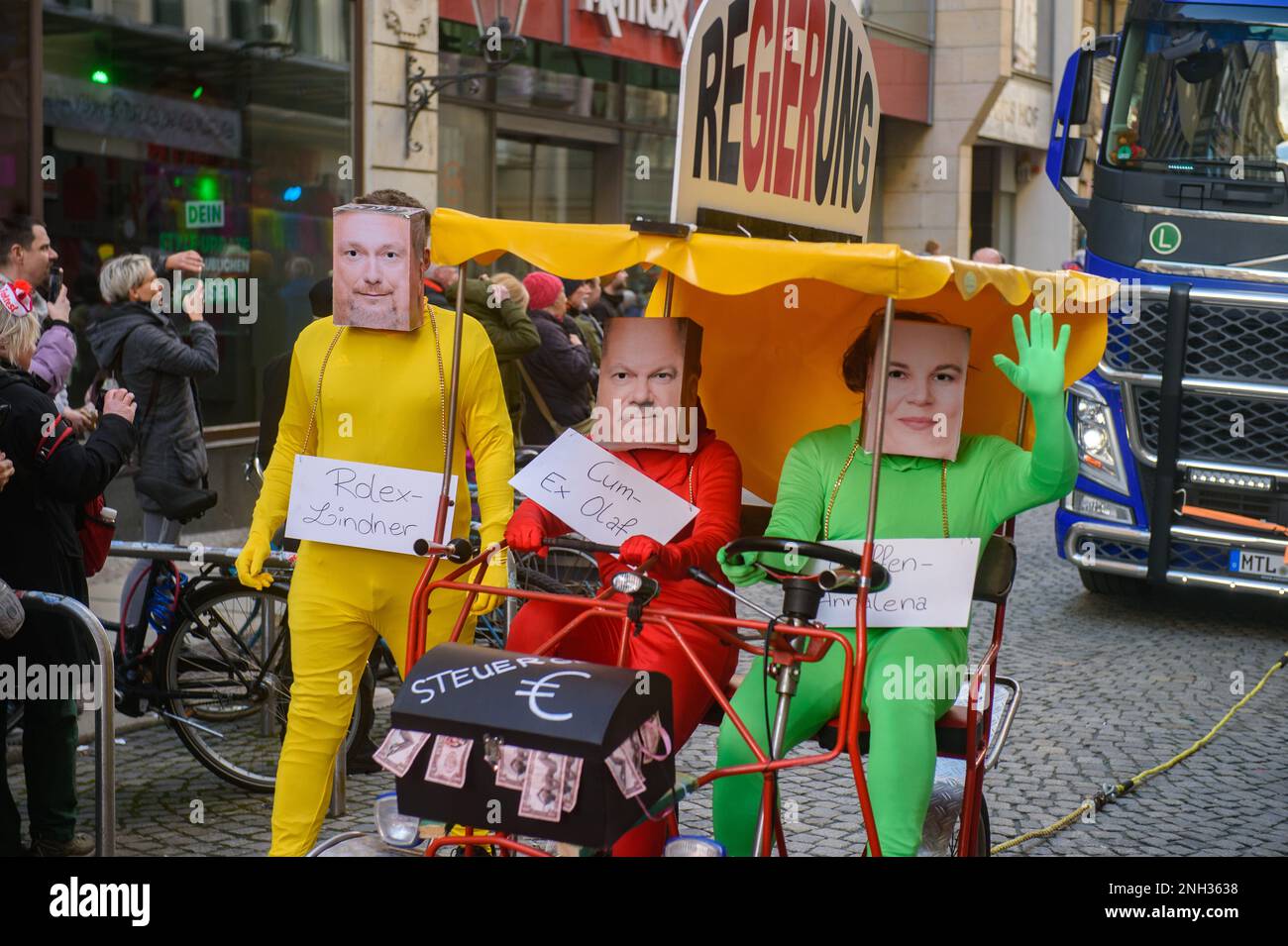 Leipzig, Germany. 19th Feb, 2023. People dressed in carnival costumes and masks of the German Federal Chancellor Olaf Scholz, Minister of Finance Christian Lindner and Minister of Foreign Affairs Annalena Baerbock take part during the carnival parade 'Große Leipziger Rosensonntagsumzug' (Great Leipzig Carnival Procession) in the city center. After three years of forced break because of the Coronavirus pandemic, the Leipzig carnival parade took place again on carnival Sunday. Shrovetide carnivals take place this week throughout Germany. Credit: SOPA Images Limited/Alamy Live News Stock Photo