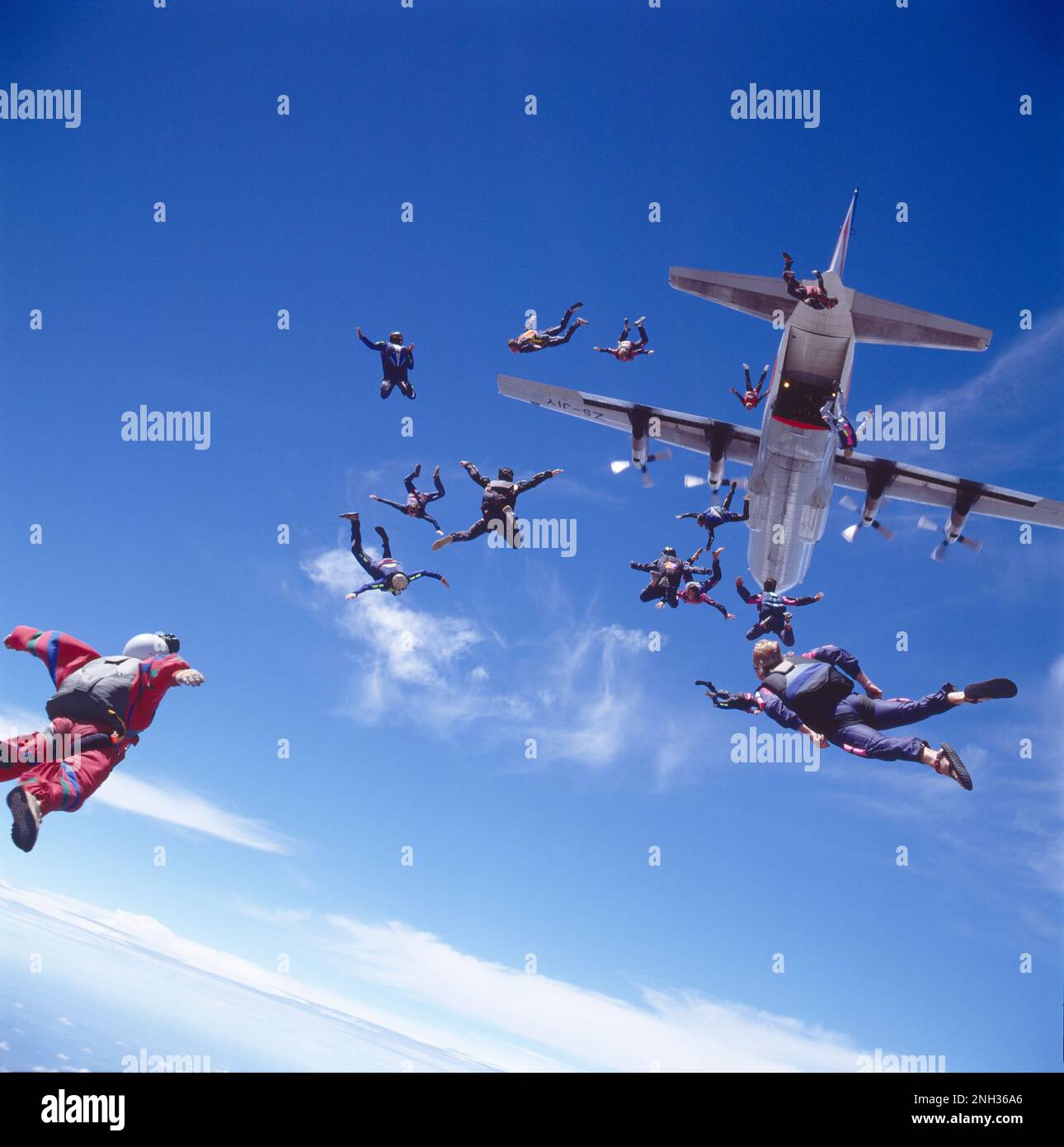 View looking up at the underbelly of the airplane that just dropped off a load of skydivers Stock Photo