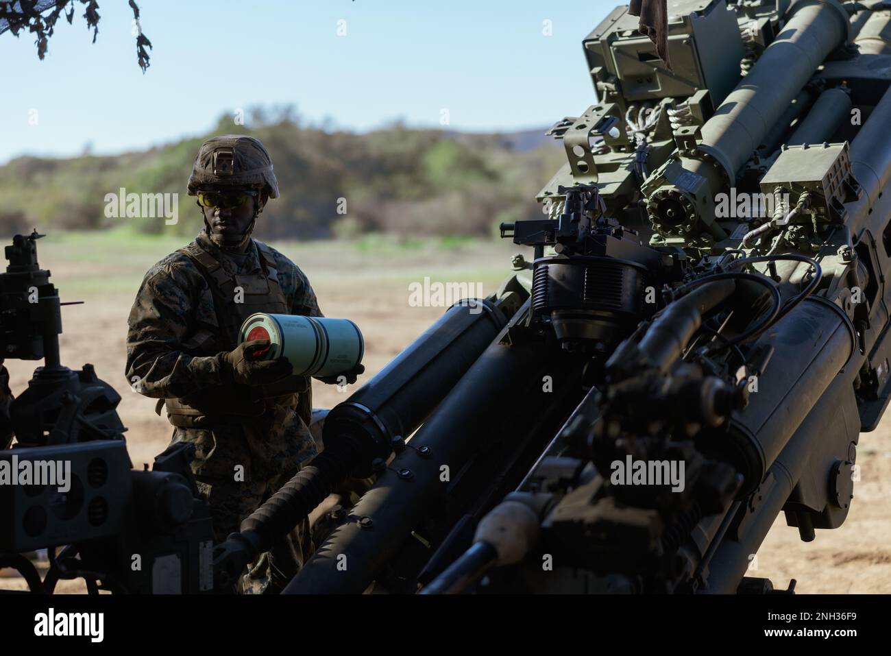 U.S. Marine Lance Cpl. Yves Mugaru, a field artillery cannoneer with ...