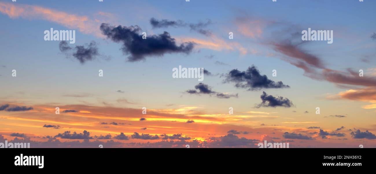 Beautiful colored cloudy evening sky. Sky with clouds at sunset. Abstract sky background. Stock Photo