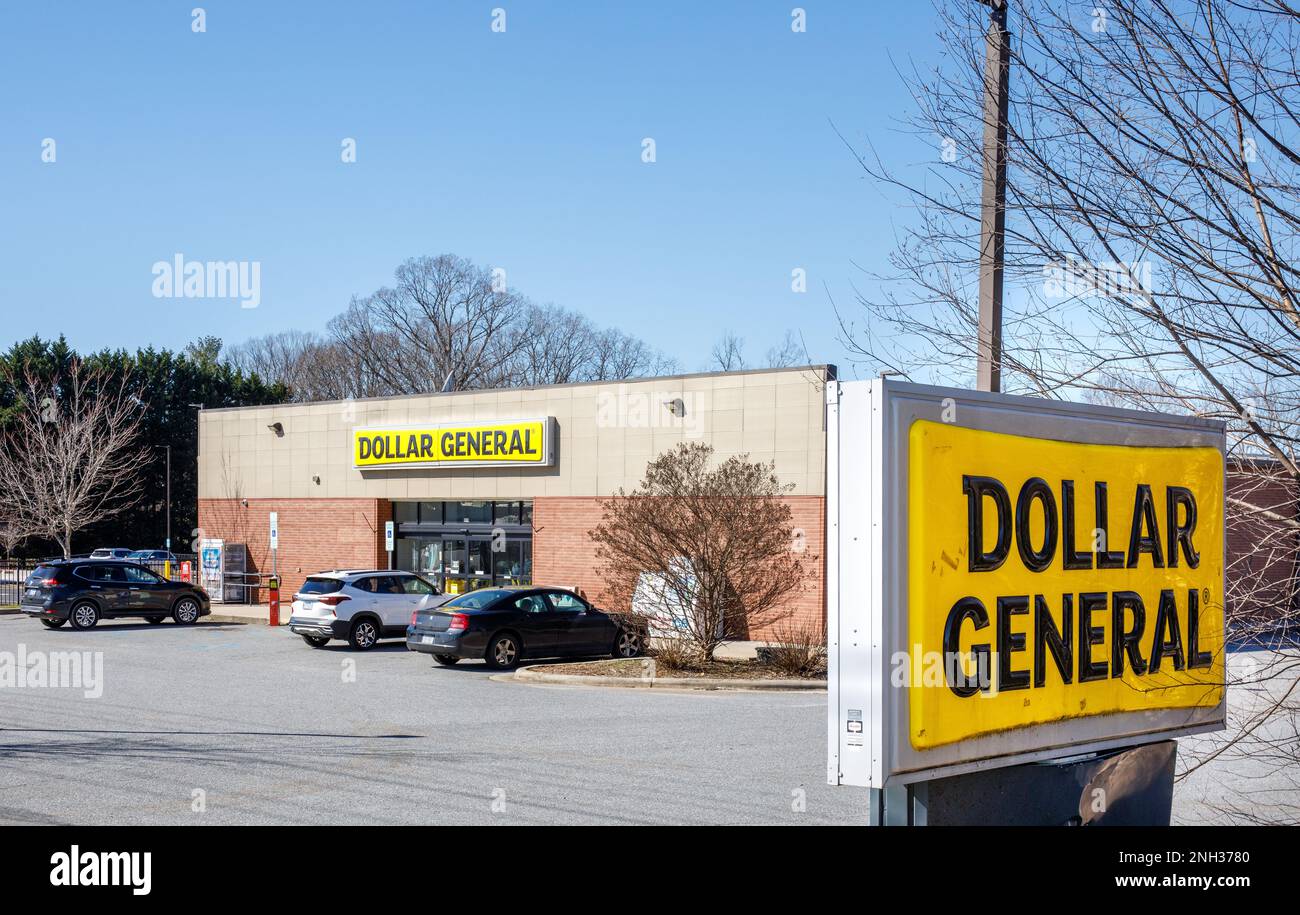 HICKORY, NC, USA-18 FEB 2023: Dollar General store, building, slightly dirty monument sign, and parking lot. Stock Photo