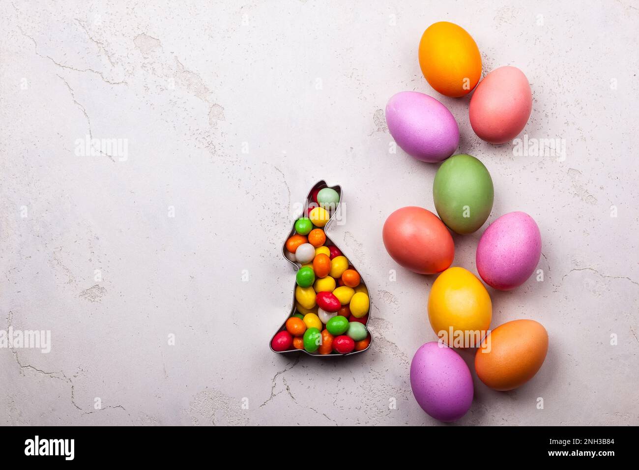 Easter concept with natural dyed easter eggs and candy. Flat lay Stock Photo