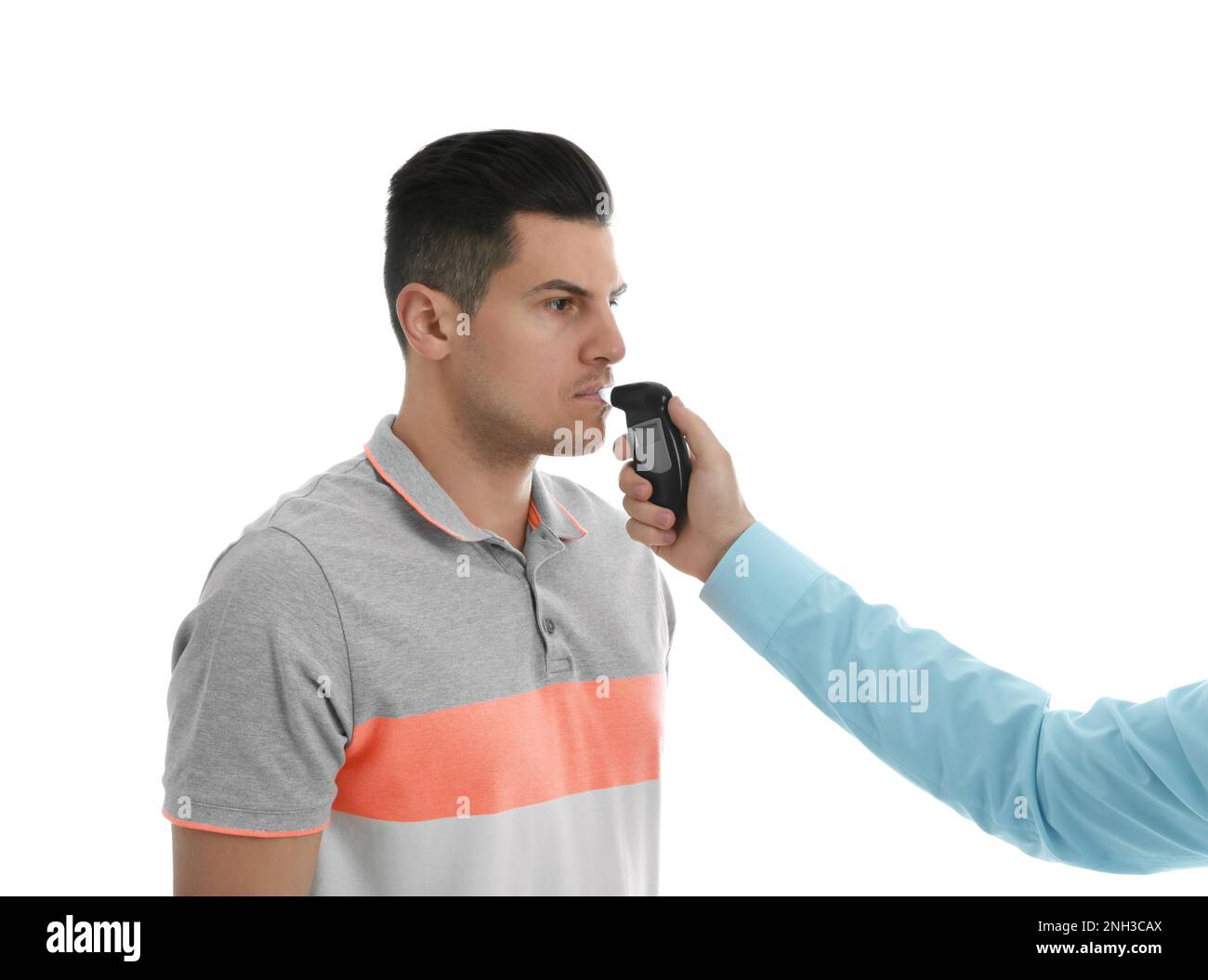 Inspector conducting alcohol breathe testing, man blowing into