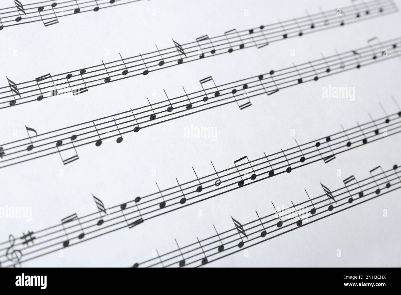 Paper sheet with musical notes, closeup view Stock Photo - Alamy